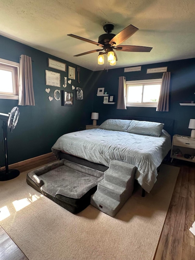 4902 Columbus Sandusky Rd N, Marion, OH 43302 - bedroom featuring multiple windows, wood finished floors, and ceiling fan