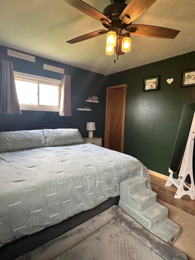 4902 Columbus Sandusky Rd N, Marion, OH 43302 - bedroom with baseboards, wood finished floors, and ceiling fan