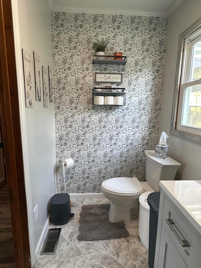 4902 Columbus Sandusky Rd N, Marion, OH 43302 - half bathroom with crown molding, toilet, vanity, and baseboards