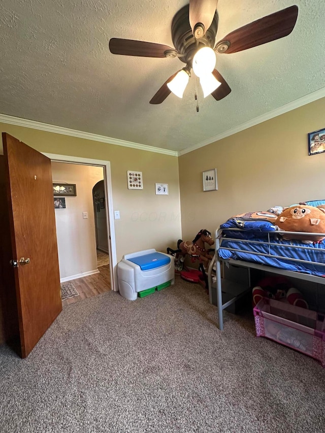 4902 Columbus Sandusky Rd N, Marion, OH 43302 - bedroom featuring carpet flooring, crown molding, a textured ceiling, and ceiling fan