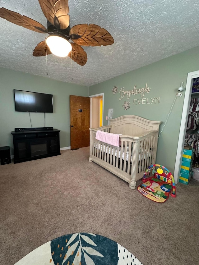 4902 Columbus Sandusky Rd N, Marion, OH 43302 - carpeted bedroom with a textured ceiling, a nursery area, ceiling fan, and a closet