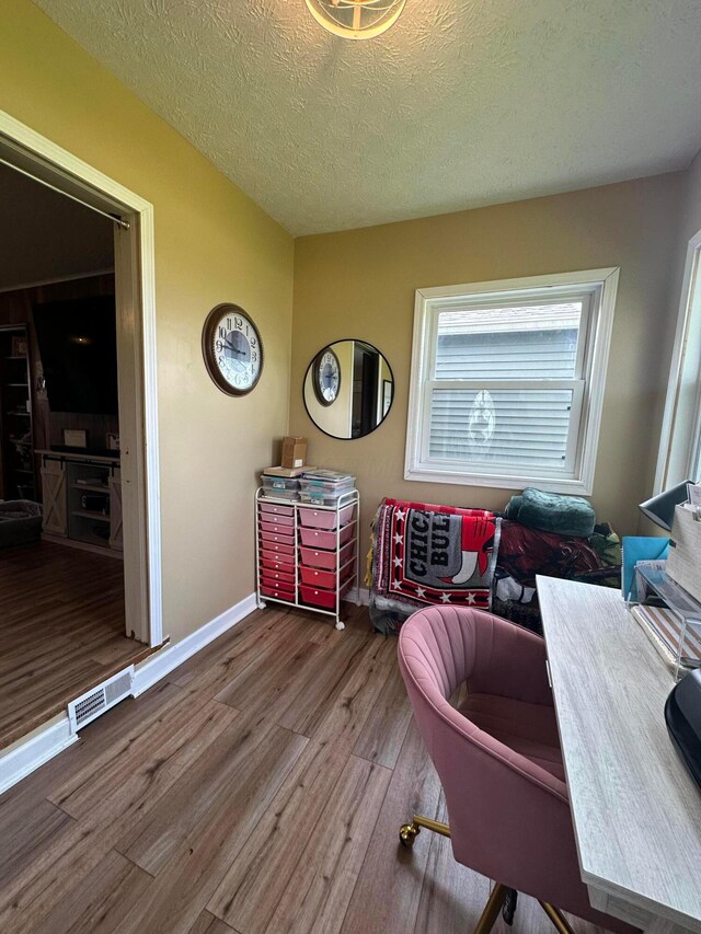 4902 Columbus Sandusky Rd N, Marion, OH 43302 - home office with wood finished floors, a textured ceiling, and baseboards