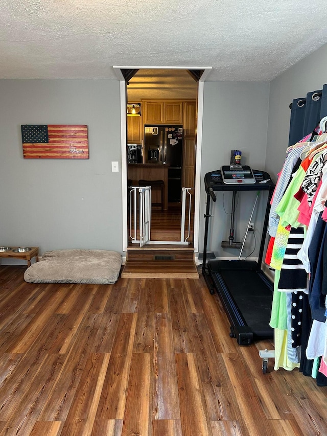 4902 Columbus Sandusky Rd N, Marion, OH 43302 - workout area featuring dark wood-type flooring and a textured ceiling