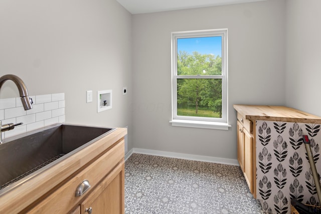 3000 State Route 257, Radnor, OH 43066 - laundry area with hookup for an electric dryer, baseboards, cabinet space, washer hookup, and tile patterned floors