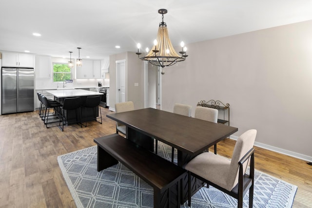 3000 State Route 257, Radnor, OH 43066 - dining room with a chandelier, recessed lighting, light wood-style flooring, and baseboards