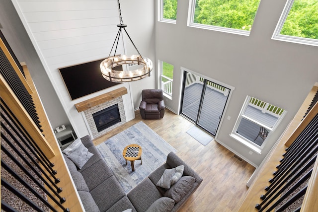 3000 State Route 257, Radnor, OH 43066 - living area featuring plenty of natural light, a chandelier, wood finished floors, and a towering ceiling
