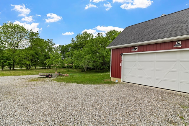 3000 State Route 257, Radnor, OH 43066 - garage featuring gravel driveway and view of scattered trees