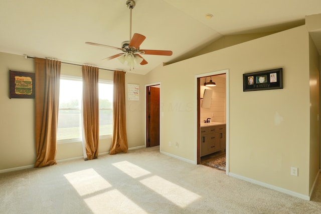 1690 Autumn Dr, Lancaster, OH 43130 - unfurnished bedroom with vaulted ceiling, light colored carpet, a sink, baseboards, and connected bathroom