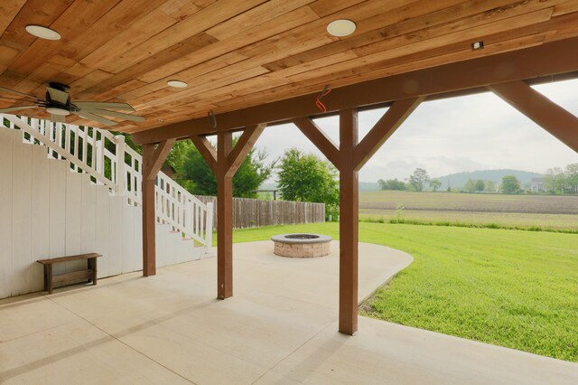 1690 Autumn Dr, Lancaster, OH 43130 - view of patio featuring a fire pit, stairway, a view of countryside, and a ceiling fan