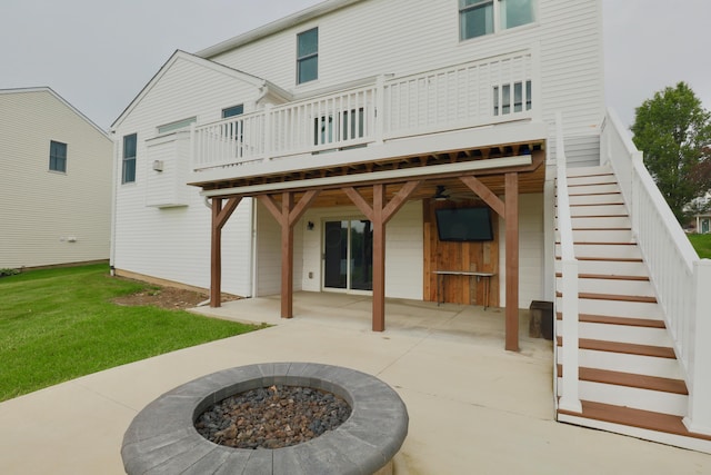 1690 Autumn Dr, Lancaster, OH 43130 - back of house with an outdoor fire pit, a patio area, a lawn, stairs, and a deck