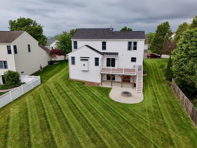 1690 Autumn Dr, Lancaster, OH 43130 - back of property featuring an outdoor fire pit, a patio, a wooden deck, and roof with shingles