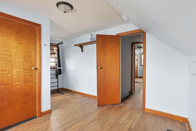 4209 Avery Rd, Hilliard, OH 43026 - spare room with light wood finished floors, baseboards, and lofted ceiling