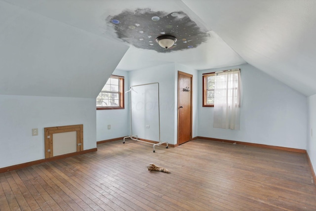 4209 Avery Rd, Hilliard, OH 43026 - additional living space featuring vaulted ceiling, hardwood / wood-style flooring, and baseboards