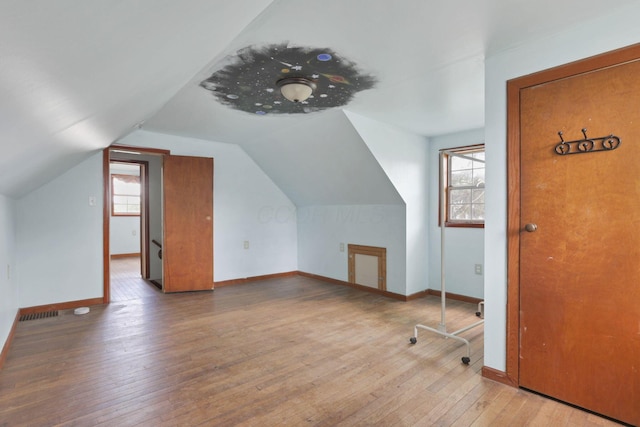 4209 Avery Rd, Hilliard, OH 43026 - additional living space with hardwood / wood-style floors, vaulted ceiling, and baseboards
