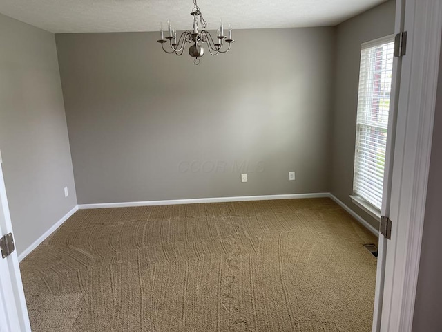 1279 Forsyth Ln, Galena, OH 43021 - empty room featuring a chandelier, carpet flooring, and baseboards