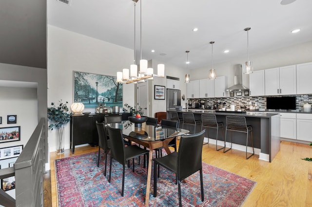 233 S Ohio Ave Unit 11, Columbus, OH 43205 - dining area featuring light wood-type flooring, recessed lighting, and a chandelier