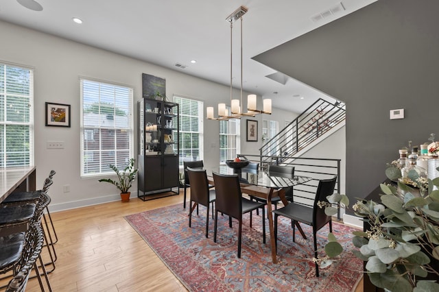 233 S Ohio Ave Unit 11, Columbus, OH 43205 - dining space featuring baseboards, light wood-style floors, a chandelier, recessed lighting, and stairway