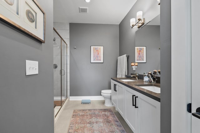 233 S Ohio Ave Unit 11, Columbus, OH 43205 - bathroom featuring double vanity, a stall shower, toilet, and tile patterned flooring