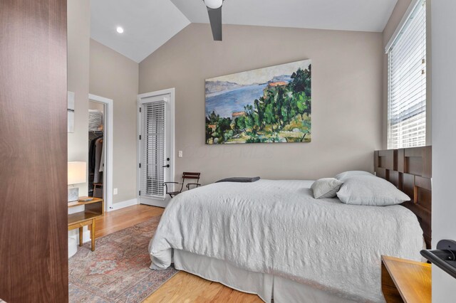 233 S Ohio Ave Unit 11, Columbus, OH 43205 - bedroom featuring wood finished floors, vaulted ceiling, a walk in closet, and recessed lighting