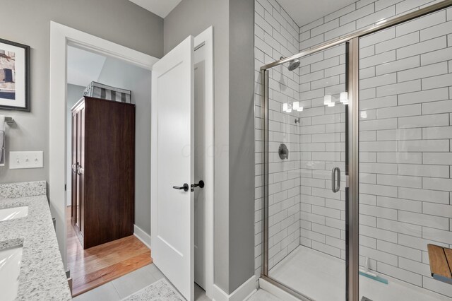 233 S Ohio Ave Unit 11, Columbus, OH 43205 - full bathroom with a shower stall, vanity, and tile patterned floors