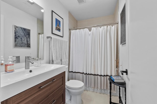 233 S Ohio Ave Unit 11, Columbus, OH 43205 - bathroom featuring toilet, vanity, tile patterned floors, and a shower with shower curtain