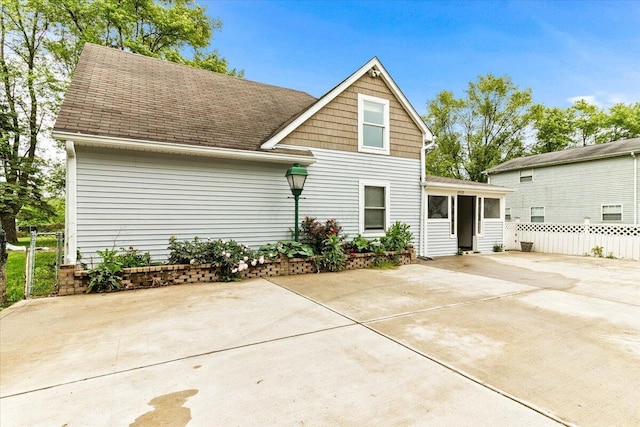 2828 Baughman Ave, Columbus, OH 43211 - back of property featuring a sunroom and roof with shingles