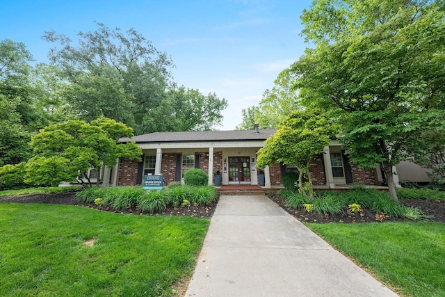2560 Scioto View Ln, Columbus, OH 43221 - view of front of home featuring a front lawn, a porch, and brick siding