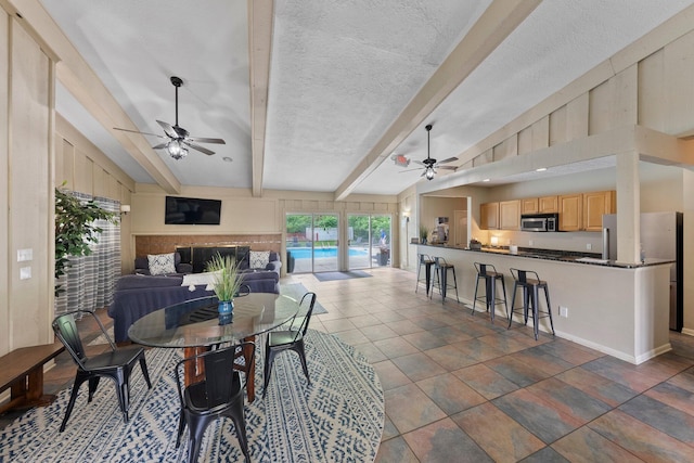 2560 Scioto View Ln, Columbus, OH 43221 - dining room with ceiling fan, beamed ceiling, and baseboards
