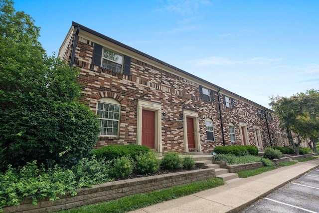 2560 Scioto View Ln, Columbus, OH 43221 - view of front facade featuring brick siding and uncovered parking