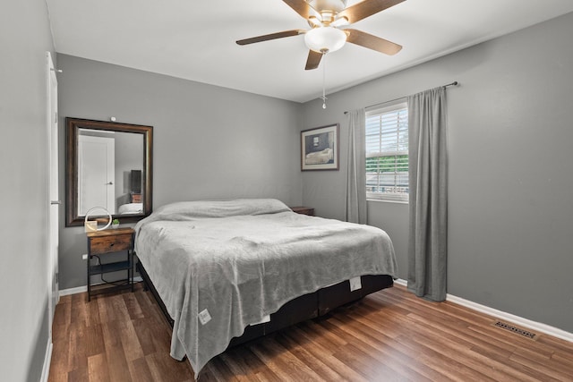 2560 Scioto View Ln, Columbus, OH 43221 - bedroom with baseboards, wood finished floors, and ceiling fan