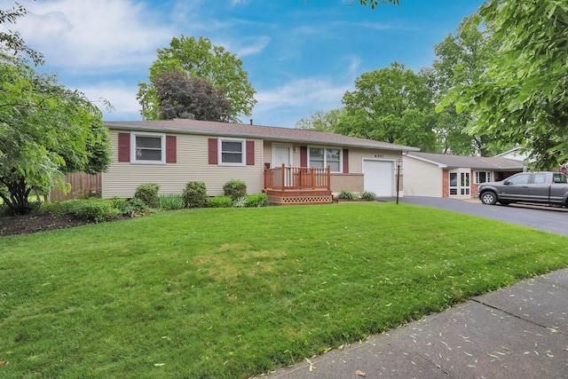 6451 Faircrest Rd, Columbus, OH 43229 - single story home featuring an attached garage and asphalt driveway