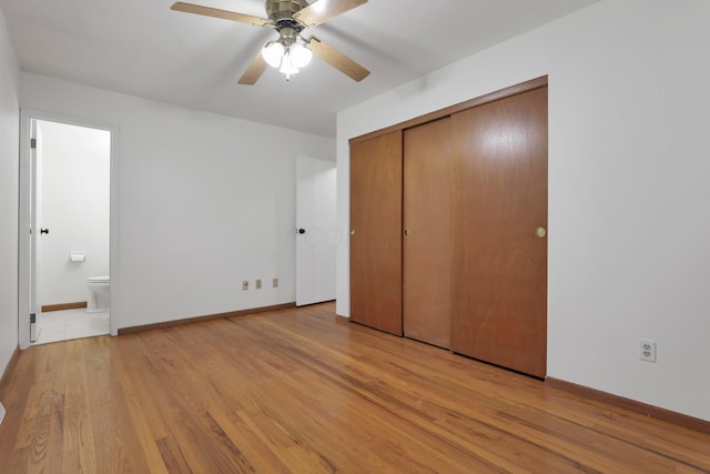 6451 Faircrest Rd, Columbus, OH 43229 - unfurnished bedroom with light wood-style floors, baseboards, and ensuite bath