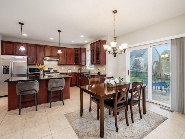 7915 Fargo Ln, Delaware, OH 43015 - dining space with plenty of natural light, light tile patterned floors, a chandelier, and recessed lighting