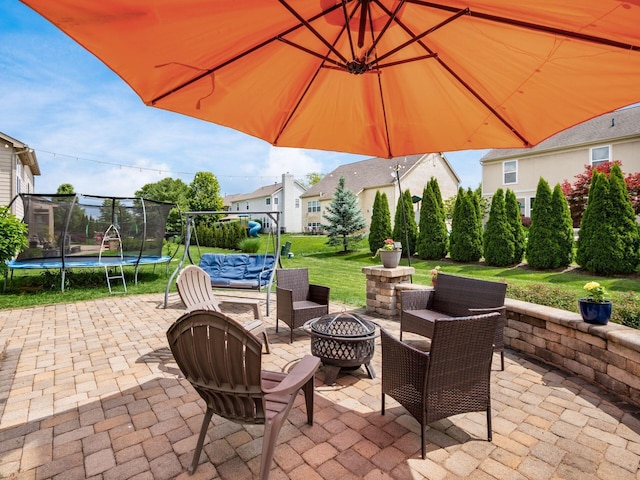 7915 Fargo Ln, Delaware, OH 43015 - view of patio with a trampoline and an outdoor fire pit