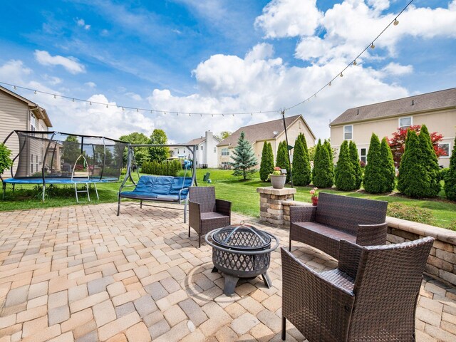 7915 Fargo Ln, Delaware, OH 43015 - view of patio / terrace with a trampoline, an outdoor living space with a fire pit, and a residential view