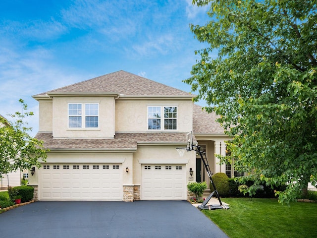 7915 Fargo Ln, Delaware, OH 43015 - view of front of home with stucco siding, driveway, an attached garage, a front yard, and stone siding