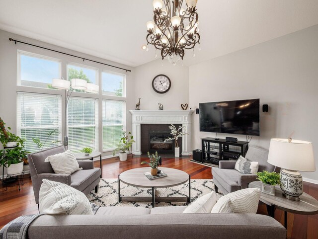 7915 Fargo Ln, Delaware, OH 43015 - living area with a chandelier, wood finished floors, and a fireplace with flush hearth