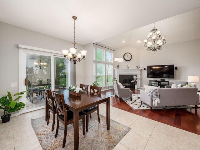 7915 Fargo Ln, Delaware, OH 43015 - tiled dining room with a chandelier and a glass covered fireplace