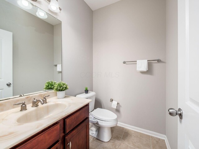 7915 Fargo Ln, Delaware, OH 43015 - bathroom featuring vanity, toilet, baseboards, and tile patterned floors