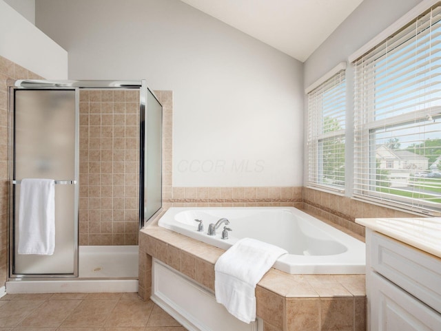 7915 Fargo Ln, Delaware, OH 43015 - bathroom with lofted ceiling, a bath, a stall shower, tile patterned floors, and vanity