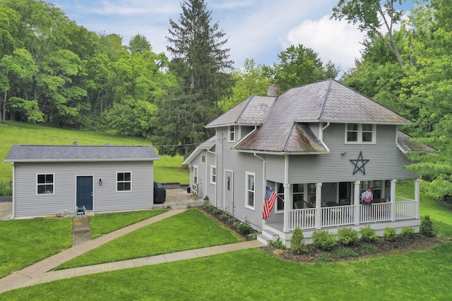 1350 Lancaster Kirkersville Rd NW, Lancaster, OH 43130 - back of property featuring covered porch, a lawn, a chimney, and an outbuilding
