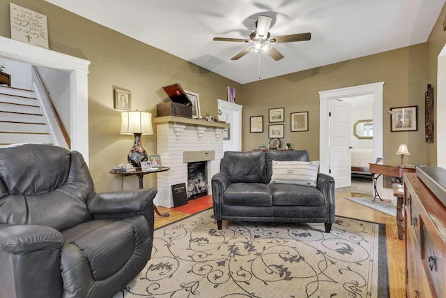 1350 Lancaster Kirkersville Rd NW, Lancaster, OH 43130 - living area featuring ceiling fan, wood finished floors, a brick fireplace, and stairway