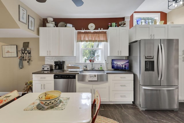 1350 Lancaster Kirkersville Rd NW, Lancaster, OH 43130 - kitchen featuring appliances with stainless steel finishes, a sink, dark marble finish floors, and plenty of natural light