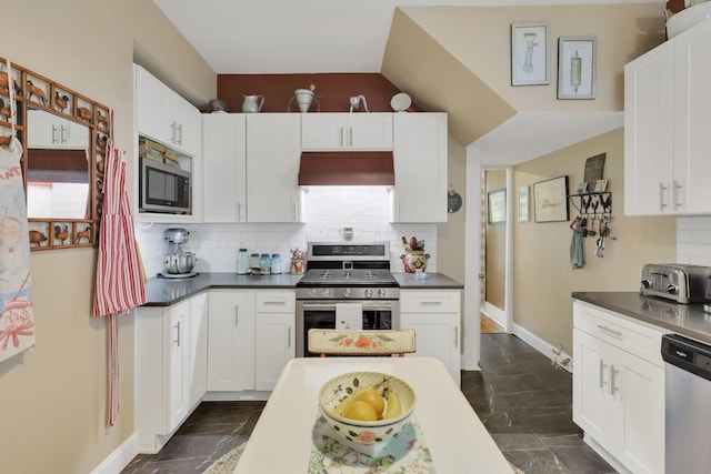 1350 Lancaster Kirkersville Rd NW, Lancaster, OH 43130 - kitchen with stainless steel appliances, dark countertops, and white cabinetry