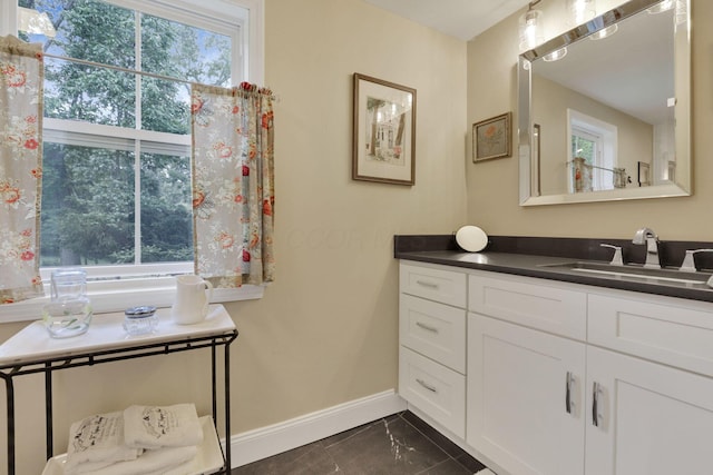 1350 Lancaster Kirkersville Rd NW, Lancaster, OH 43130 - bathroom with baseboards, vanity, marble finish flooring, and healthy amount of natural light