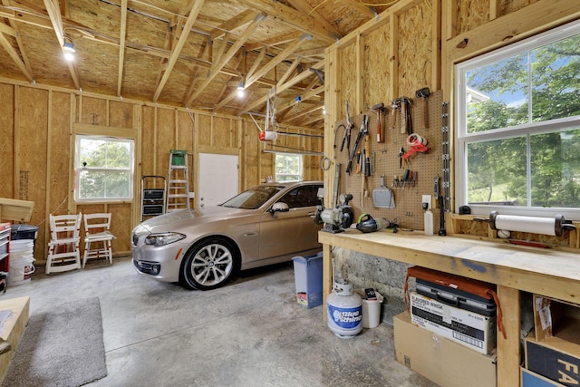1350 Lancaster Kirkersville Rd NW, Lancaster, OH 43130 - garage with a garage door opener and a workshop area