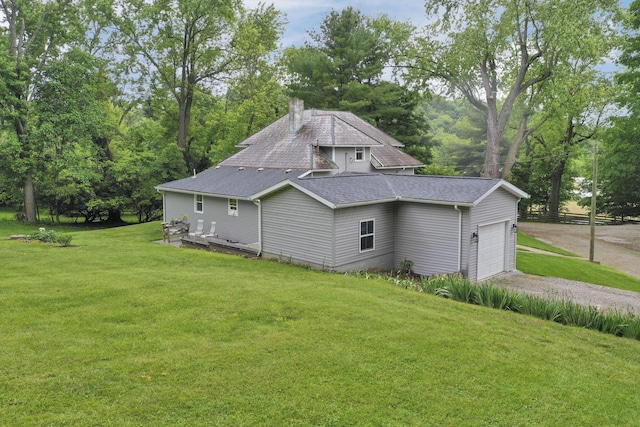 1350 Lancaster Kirkersville Rd NW, Lancaster, OH 43130 - view of home's exterior featuring driveway, roof with shingles, a garage, a yard, and a chimney