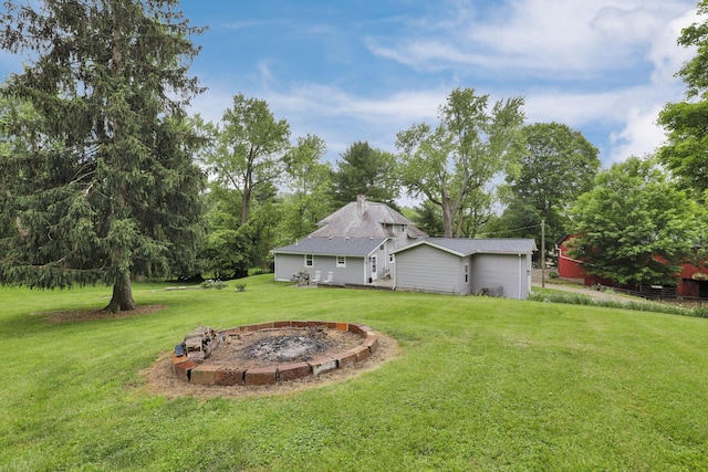 1350 Lancaster Kirkersville Rd NW, Lancaster, OH 43130 - view of grassy yard with a fire pit