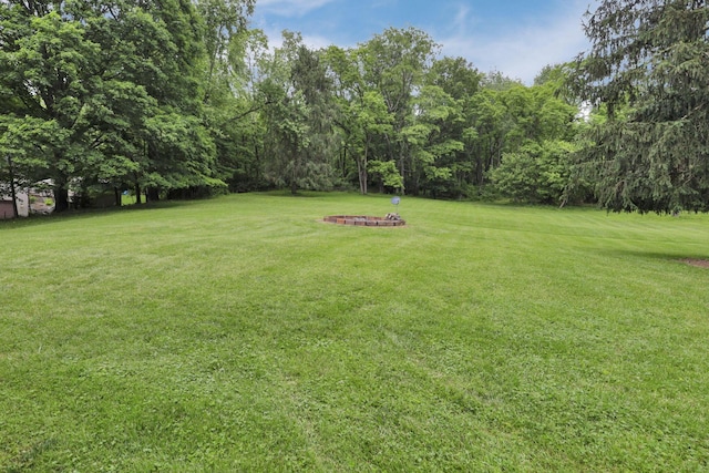 1350 Lancaster Kirkersville Rd NW, Lancaster, OH 43130 - view of green lawn featuring a fire pit