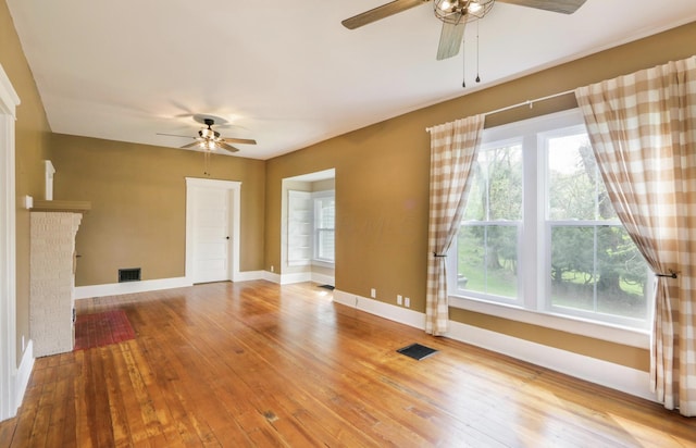 1350 Lancaster Kirkersville Rd NW, Lancaster, OH 43130 - unfurnished living room featuring ceiling fan, wood-type flooring, and healthy amount of natural light